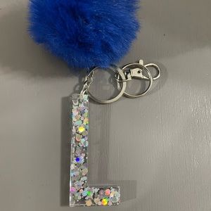 Letter L keychain with royal blue puff ball